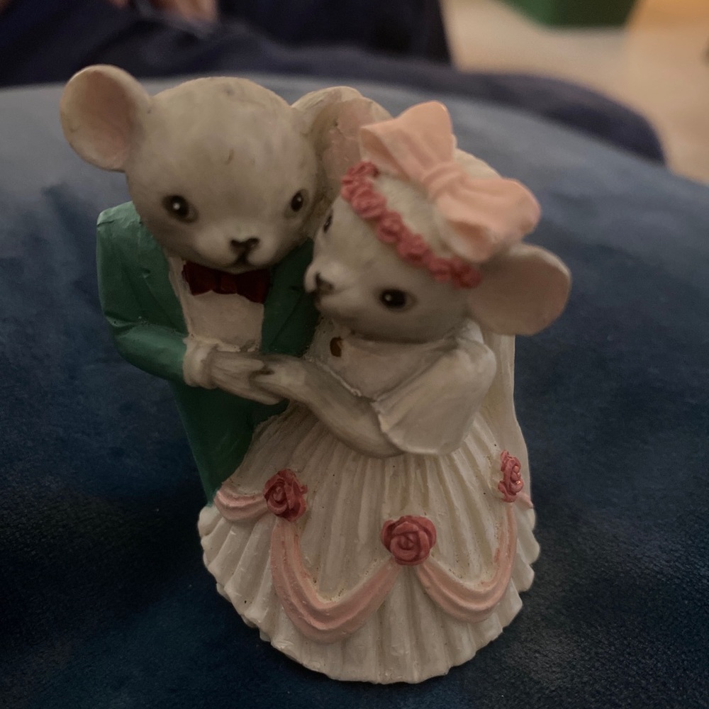 Mice getting married figurine.